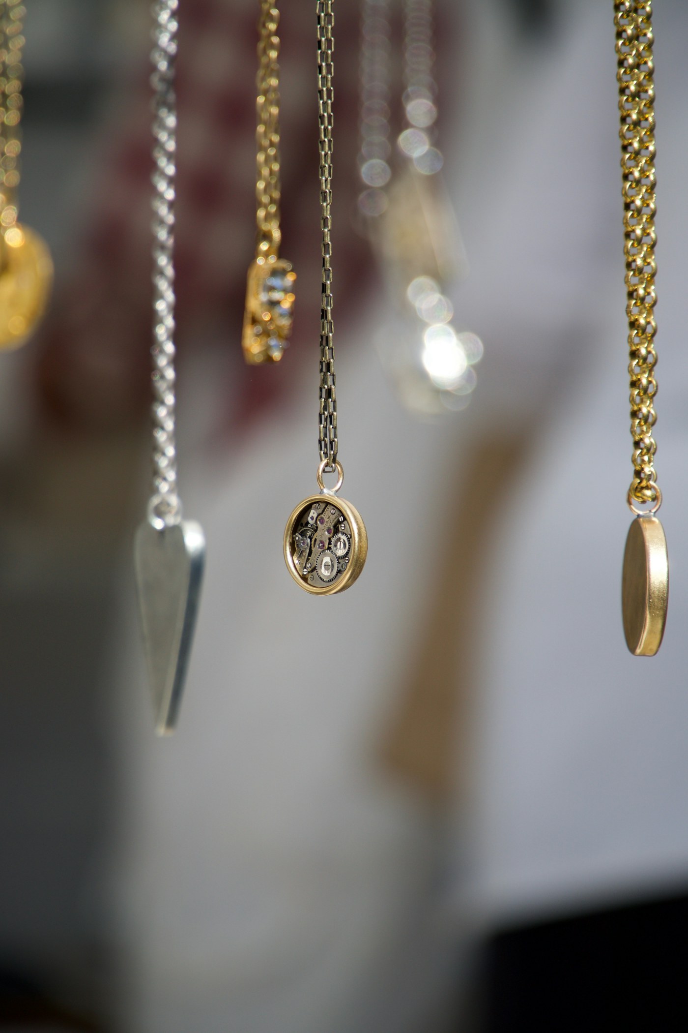 Gold necklace against a dark ground
